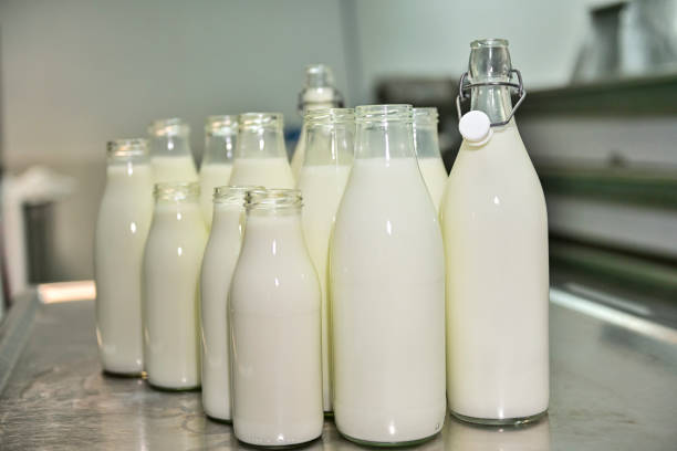 istock Glass bottles, filled with fresh goat's milk 1414057682