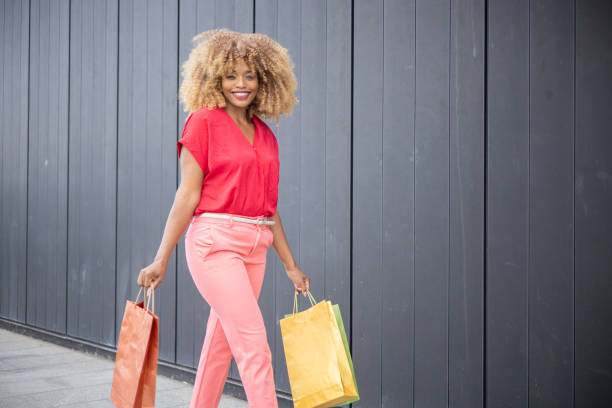istock Young woman coming back from shopping 1414058407