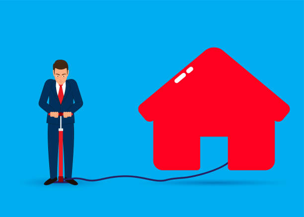 istock Man inflates a house, real estate agent, house purchase, building construction... 1414059653