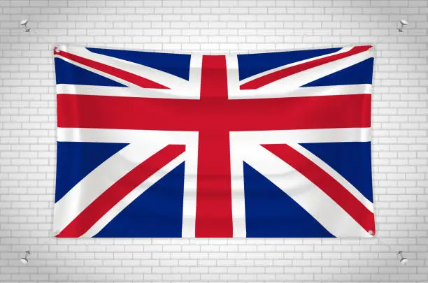 Vector illustration of United Kingdom flag hanging on brick wall.