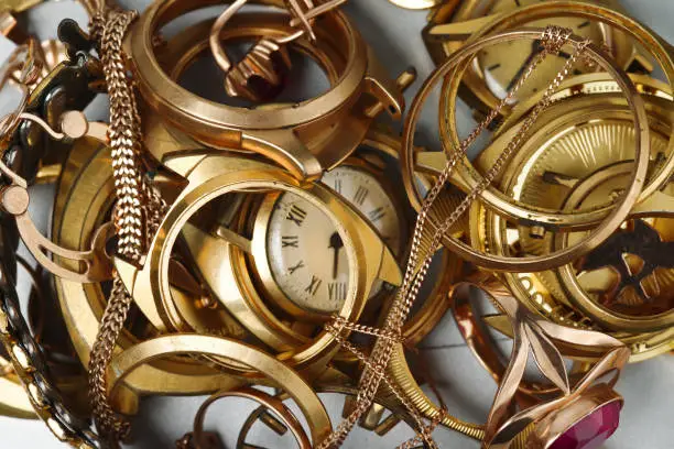 A scrap of gold. Old and broken jewelry, coins, watches of gold, and gold-plated