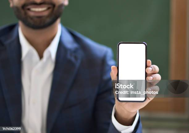 Business Man Showing White Mock Up Phone Screen Mockup Cellphone Template Stock Photo - Download Image Now