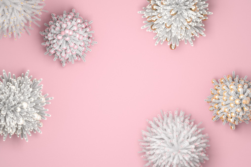 White Christmas trees with lights and decorations on pink background, view from above.
