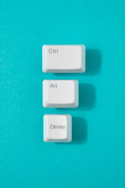Control, alt and delete retro keys on a teal background. Control, alt and delete retro keys on a teal background. Reset, recession minimal concept. delete key stock pictures, royalty-free photos & images