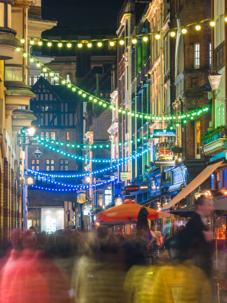 istock London crowded streets of Soho pubs bars illuminated at night 1414071243
