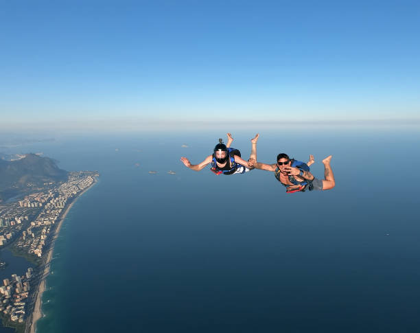 Skydiving in the Rio de Janeiro. Skydiving in the Rio de Janeiro. A summer day, shirtless on the beach. airborne sport stock pictures, royalty-free photos & images