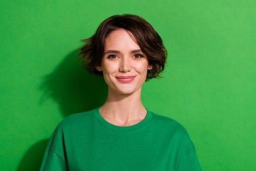 Photo of satisfied glad person smile look camera isolated on green color background.