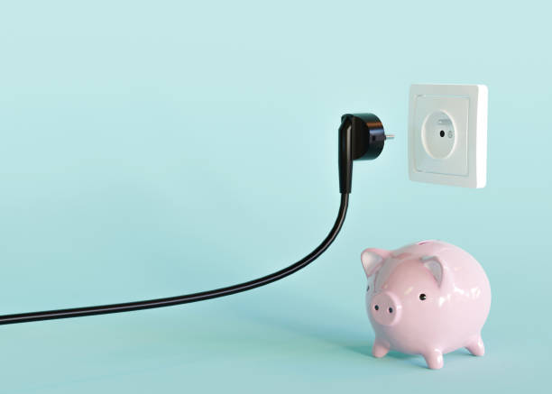 istock Black electrical plug, electric socket and piggy bank. Ready to connect. Free, copy space for your text, advertising. Save electricity, electricity is getting more expensive. 3d rendering. 1414075021