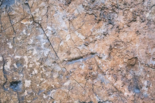 istock old weathered rock wall with beautiful cracks, pattern and texture, colorful background, textured surface 1414075176