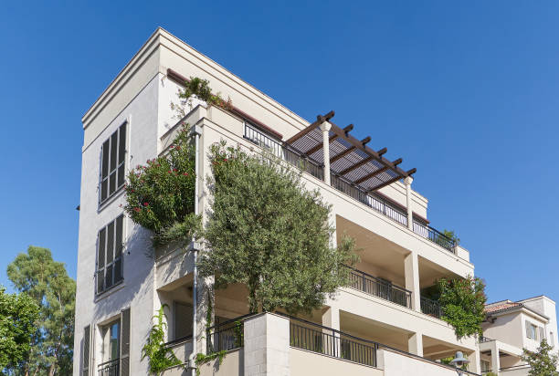 istock Modern residential building with plants and trees 1414075199