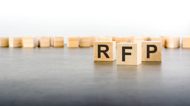 istock three wooden cubes with the letters RFP on the bright surface of a gray table 1414076437