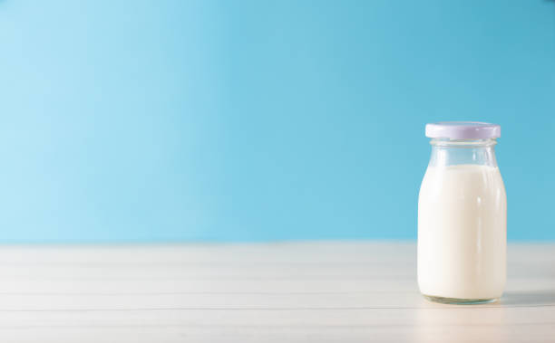 istock Cow's milk in a glass bottle 1414076783