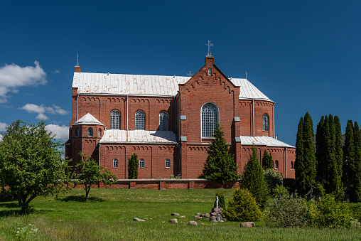 Kalupe Catholic church in sunny summer day, Latvia.
