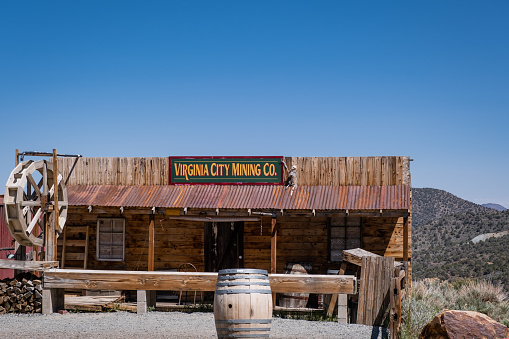 3D illustration rendering of an empty street in an old wild west town with wooden buildings.