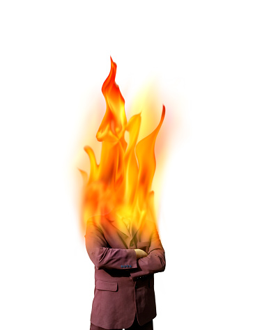 Conceptual business and finance image of burning businessman