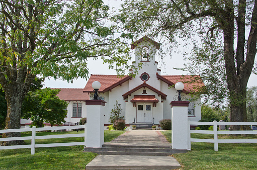 The Longview Chapel, located in Lee's Summit, Missouri, is just one of several historical buildings located within Longview Farms.  Each building, including the home of Richard Long, ornate horse barns and outbuildings scattered throughout a large parcel of land, is immediately recognizable, with red tiled roofs and whitewashed exterior walls.  Long was a Kansas City lumberman who built the farm in 1914 as a respite for his family, but it was also a large working farm.