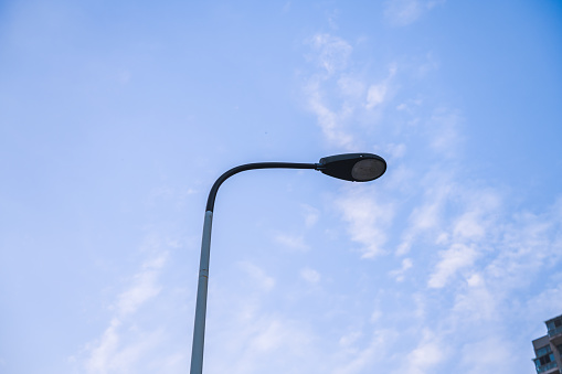 Street lamps with clear blue sky in the background and copy space. Urban and light concept