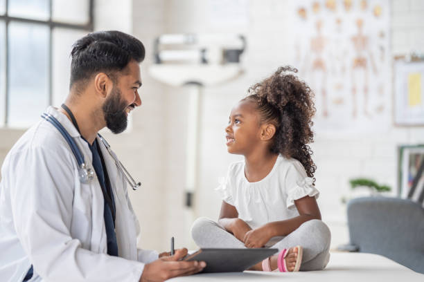 istock Doctor Seeing a Young Patient 1414087429