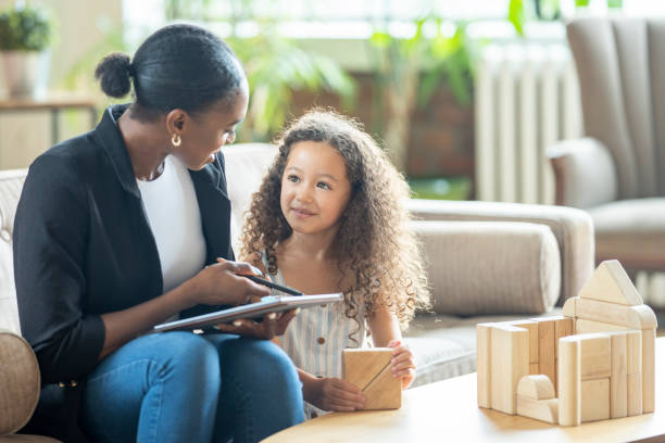 istock Play Therapist Working with a Little Girl 1414093487