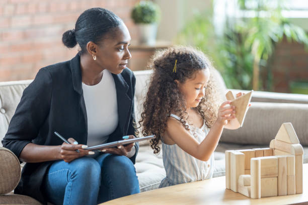 istock Play Therapist Working with a Little Girl 1414093492