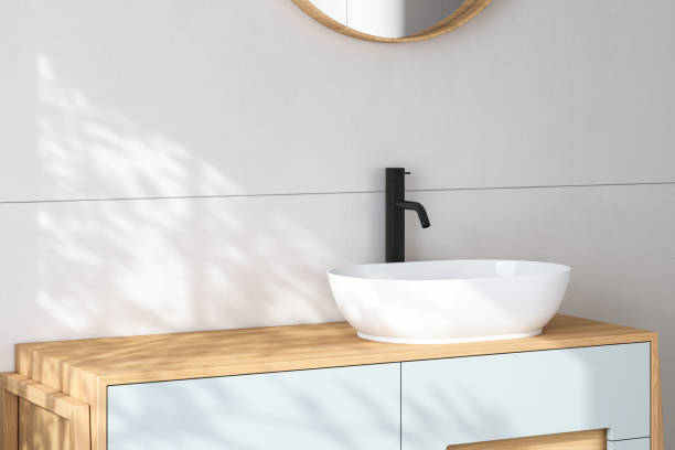 istock 3D render an wooden vanity counter with whiteceramic washbasin 1414094715