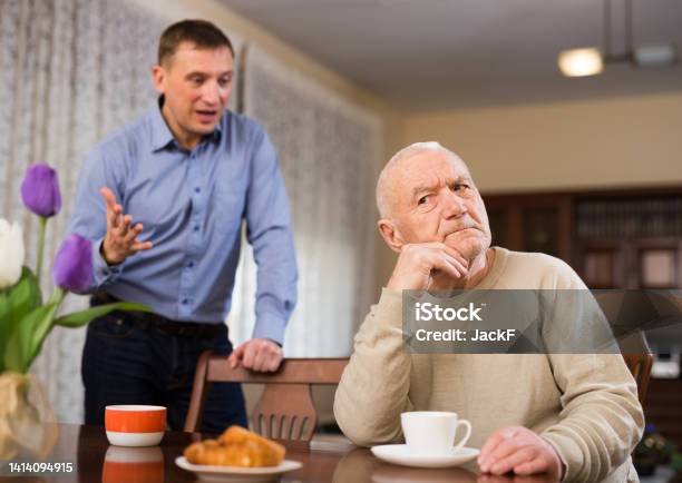 Man And His Adult Son Having Conflict Stock Photo - Download Image Now - Adult Offspring, Arguing, 45-49 Years