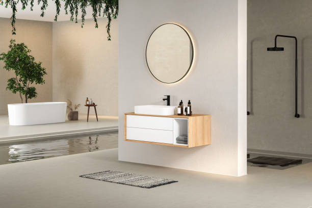 istock Minimal bathroom interior with white and concrete walls, white basin with oval mirror, bathtub, shower 1414095053