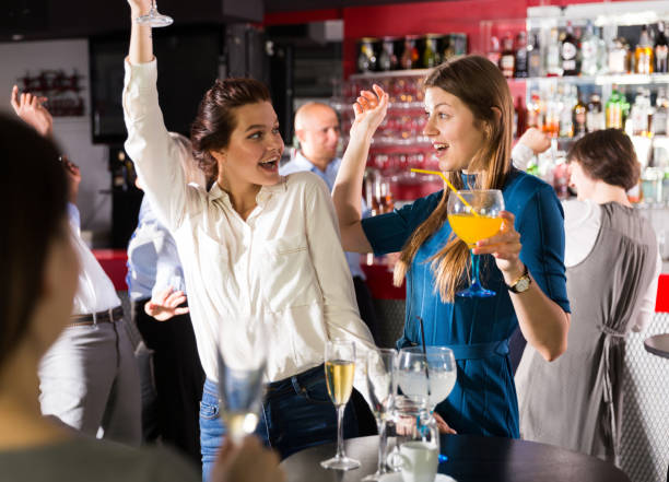 istock Young women enjoying corporate party 1414095308