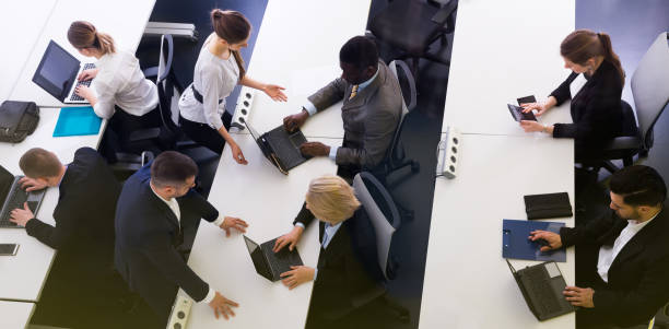 istock Top view of group of business pairs during work 1414096887