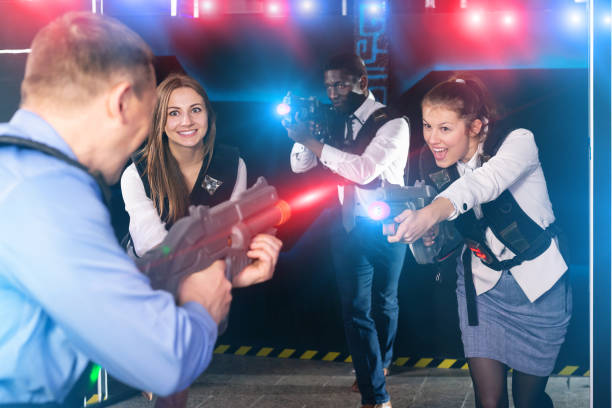 istock men and women co-workers having corporate entertainment 1414097656