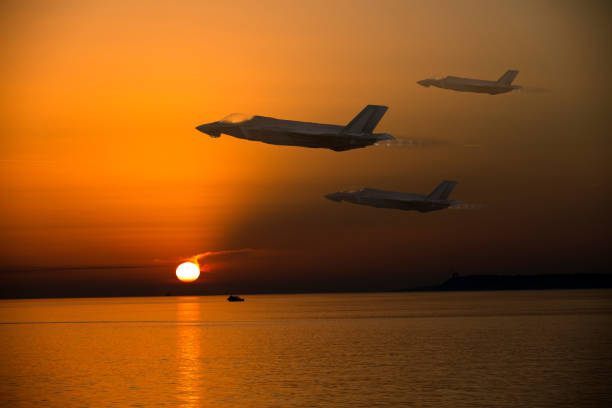 istock F-35 fighter jets flying on sunset 1414107370