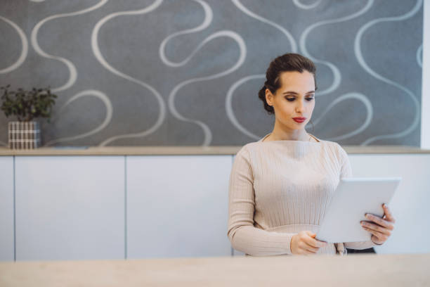 istock Businesswoman looking at some papers 1414107473