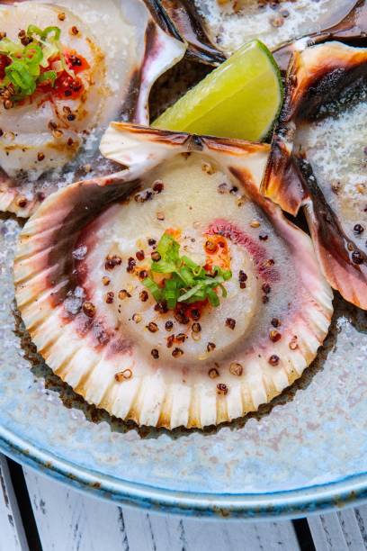istock Grilled scallops with butter, quinoa pop, garlic, lime 1414110667