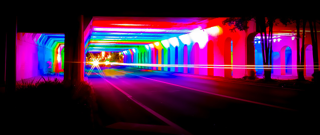 Night time photograph of the rainbow tunnel in Birmingham, Alabama