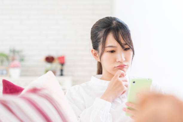 istock attractive Asian woman using a smart phone,think, 1414115792