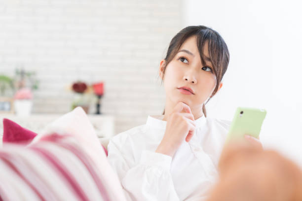 istock attractive Asian woman using a smart phone,think, 1414115884