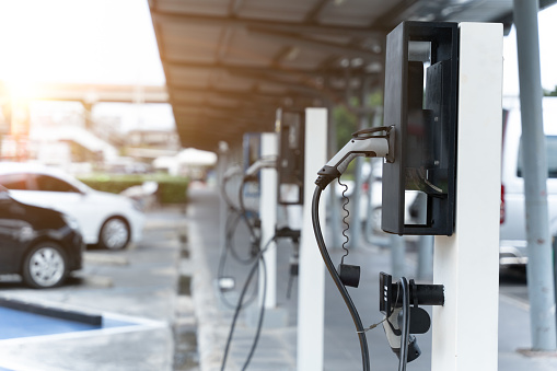 Electric car on electric car charging station. Power supply for electric car charging. Clean energy concept