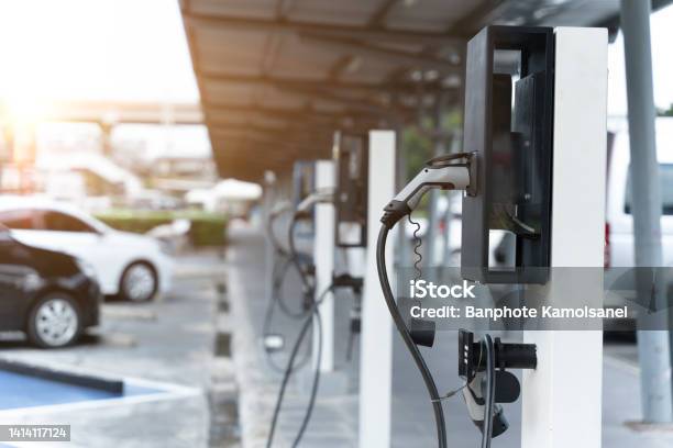 Electric Car On Electric Car Charging Station Power Supply For Electric Car Charging Clean Energy Concept Stock Photo - Download Image Now