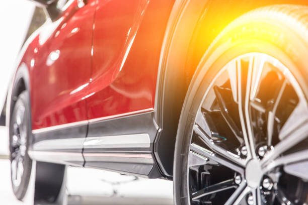 Low angle closeup of a red new car