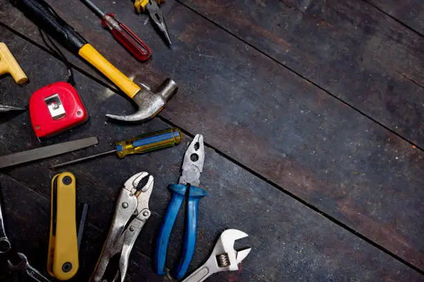 Close-up on a bunch of tools on a table at a workshop - DIY concepts