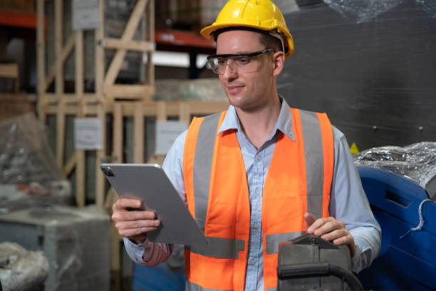 istock Engineer hold tablet to check spare parts inventory list 1414127307