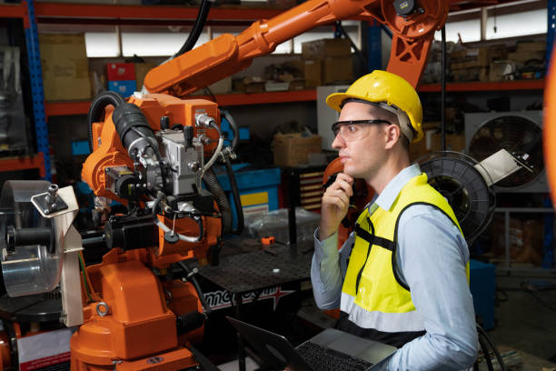 istock Engineer  working in factory welding robotic troubleshoot checking welding head 1414127945