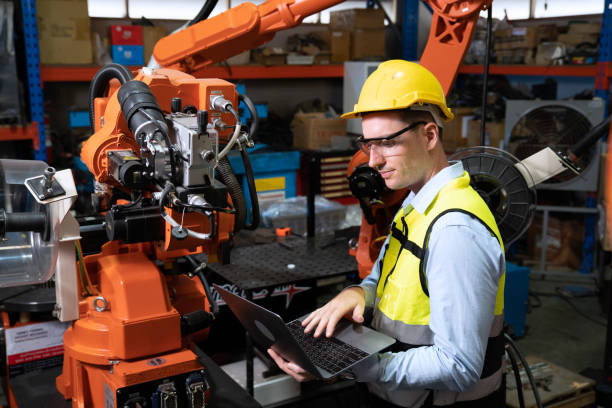 istock Engineer  working in factory welding robotic troubleshoot checking welding head 1414127961