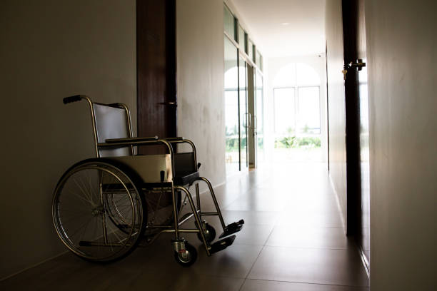 istock Empty wheelchair left in hospital corridor. 1414129810