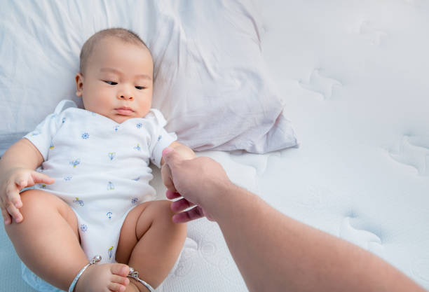 istock The tiny little hand newborn baby development concept 1414130603