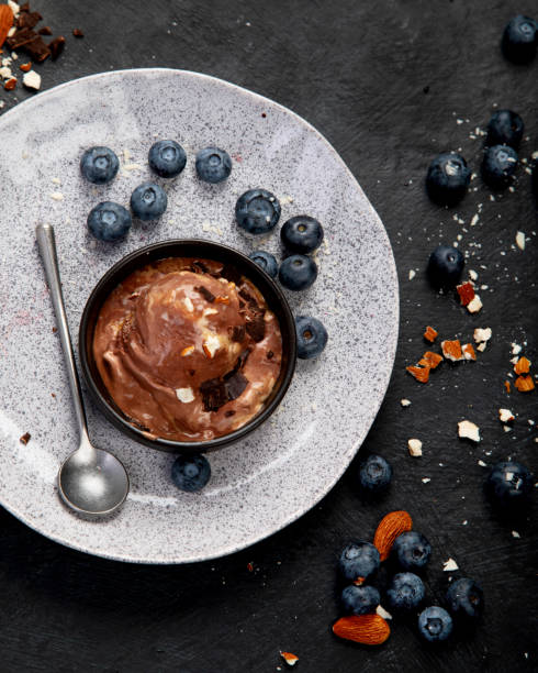 istock Chocolate ice cream with berries on dark background 1414139785