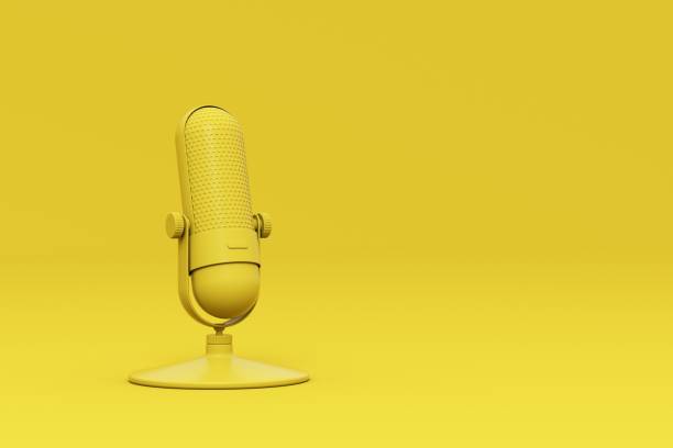 istock yellow microphone isolated on yellow minimal style background. 1414144354