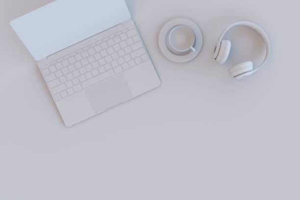 istock Top view desktop with Laptop, headphones, cup of coffee 3d rendering. 1414144414