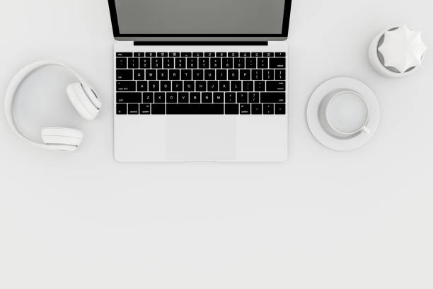 istock Top view desktop with Laptop, headphones, cup of coffee 3d rendering. 1414144478
