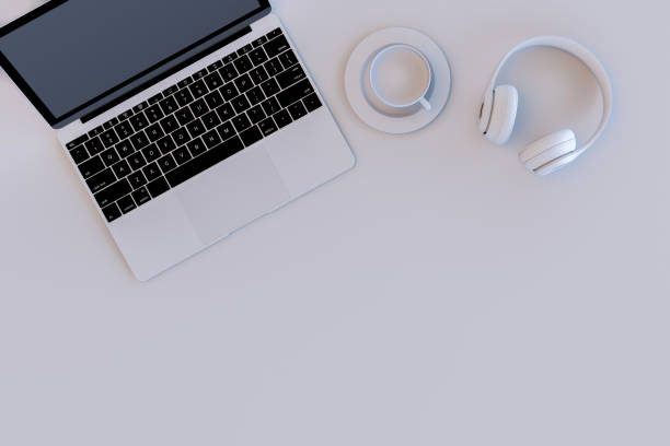 istock Top view desktop with Laptop, headphones, cup of coffee 3d rendering. 1414144483